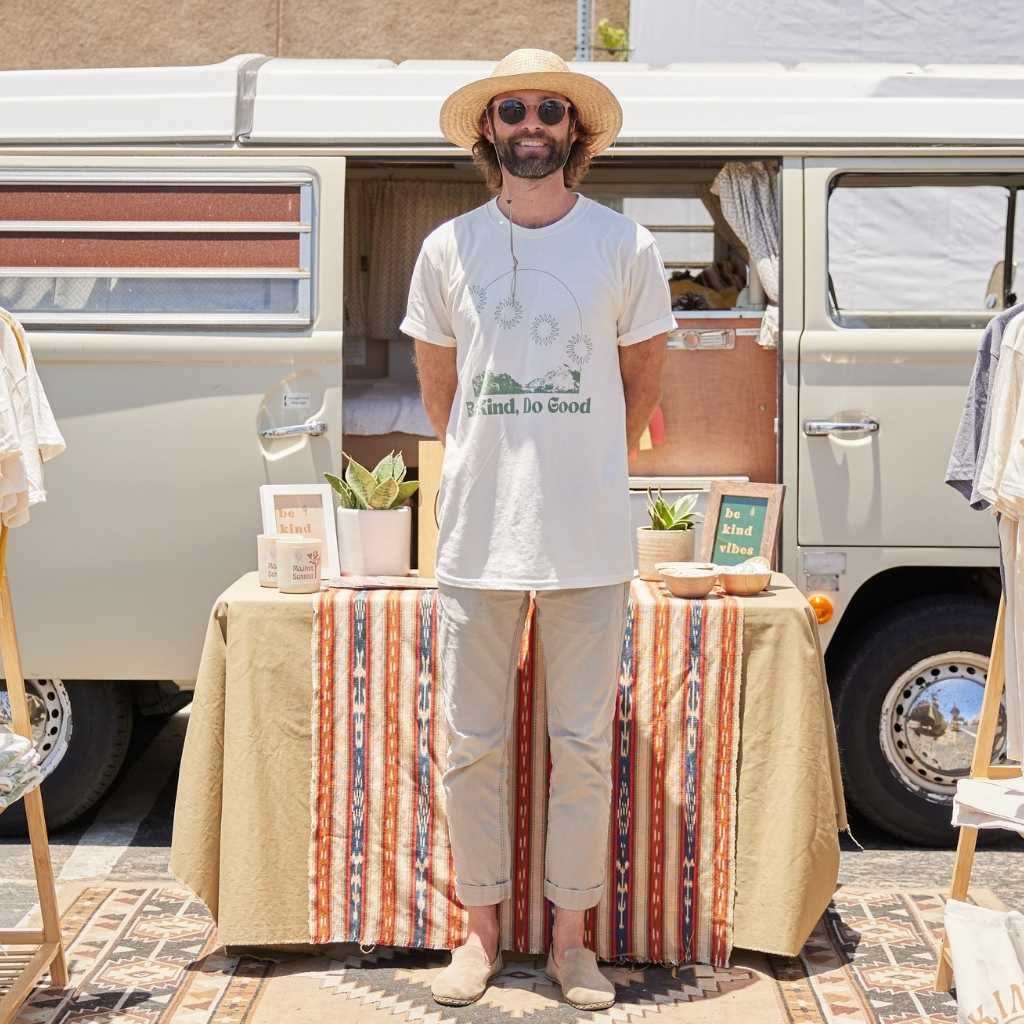 Hero image featuring Be Kind Vibes mobile pop up shop with sustainably made t-shirts, crop tops, and accessories.