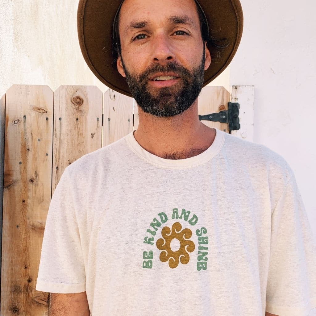 Hero image featuring the front of the Be Kind Vibes Be Kind & Shine tee in natural
