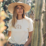 Hero image featuring the front of the Be Kind Vibes Desert Waves tee in natural