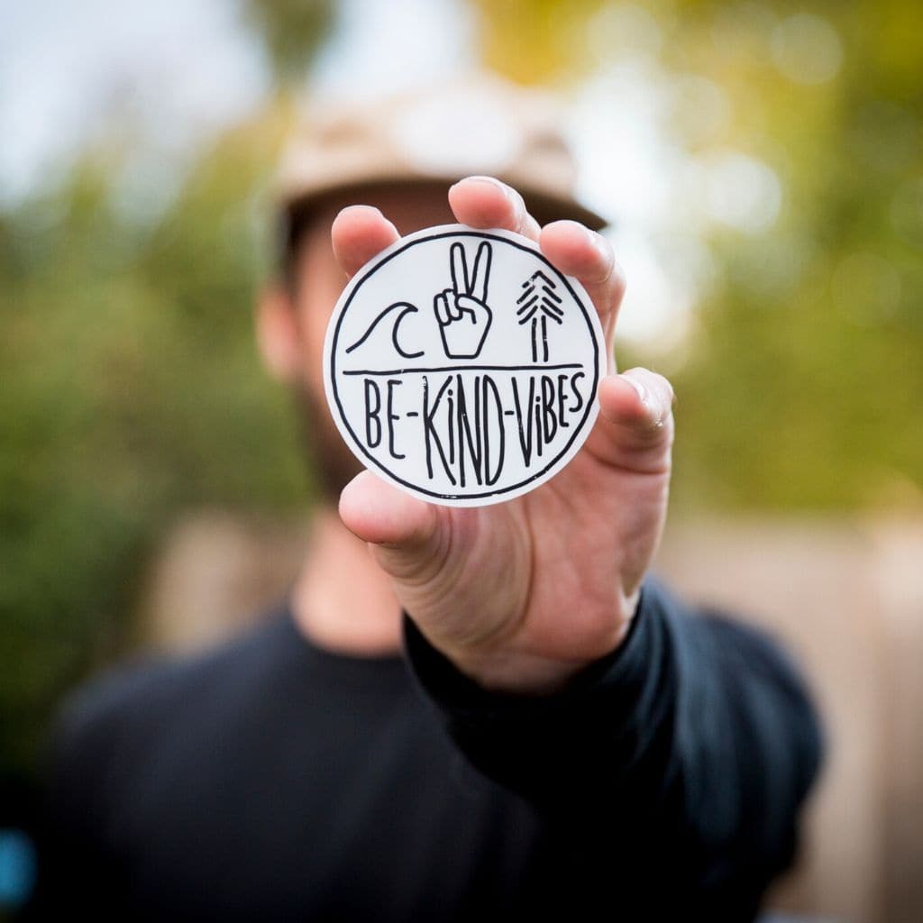 Hero image featuring the front of the Be Kind Vibes logo sticker