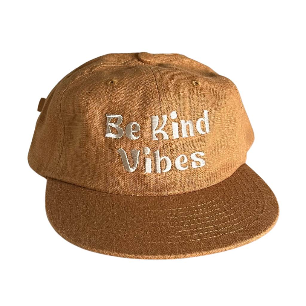Hero image featuring the front of the Be Kind Vibes Be Kind Hemp Hat in rust with the text Be Kind Vibes embroidered on the front.