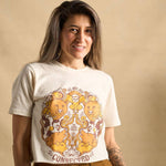 Hero image features a female model wearing the Be Kind Vibes We Are All Connected crop top with an animal design on the front featuring bears, cows, chickens, wolves, pigs, and an owl.