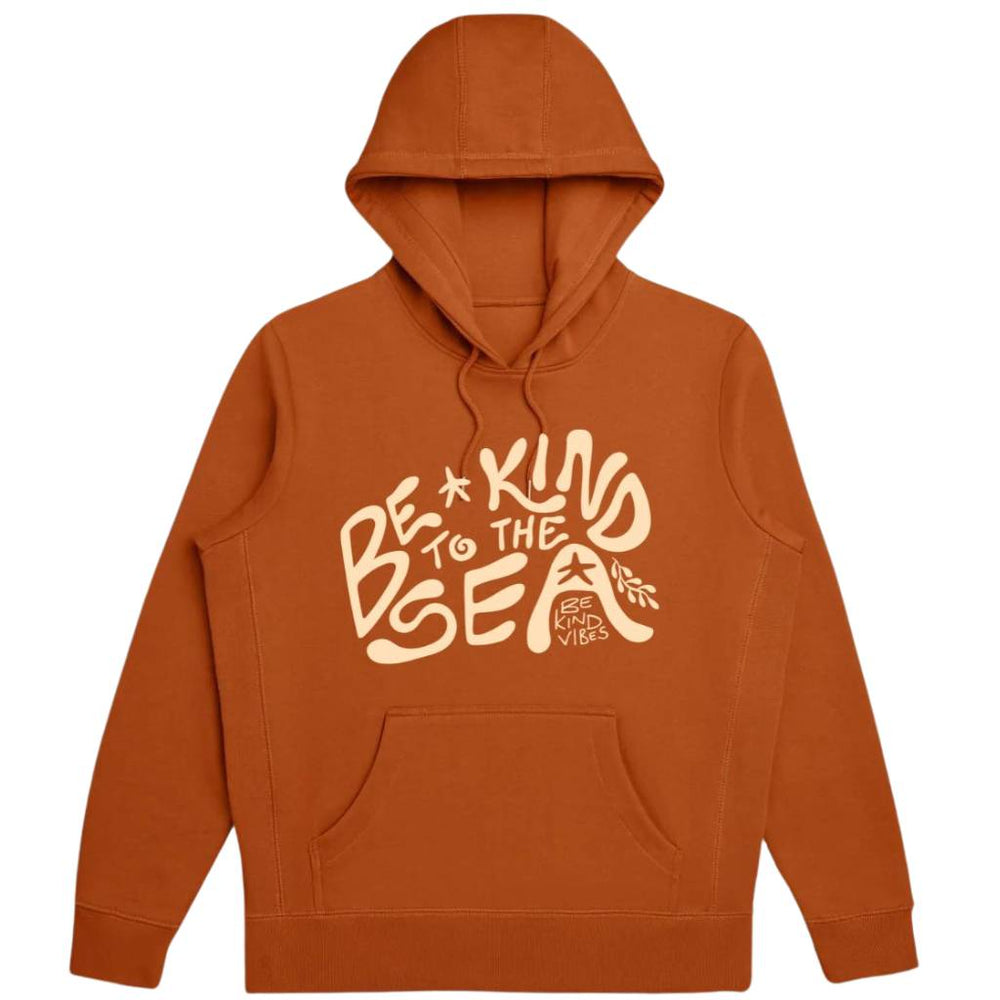 Hero image features a product image on a white background of the Be Kind Vibes 100% organic cotton To the Sea Hoodie in burnt orange.