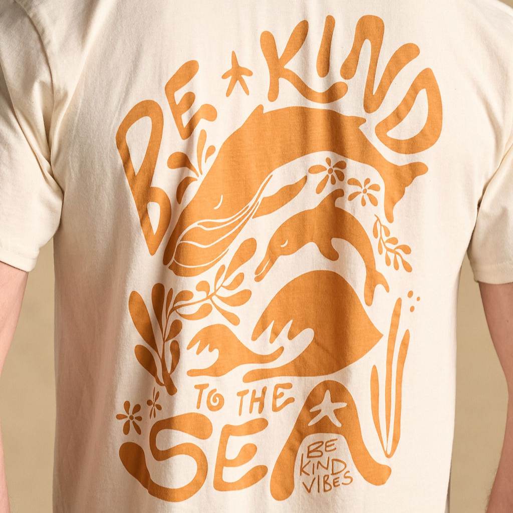 
                  
                    Image features the back design of the Be Kind Vibes organic cotton To the Sea t-shirt which features a whale, dolphin, ocean waves, and ocean plants with the text Be Kind to the Sea and Be Kind Vibes written throughout.
                  
                