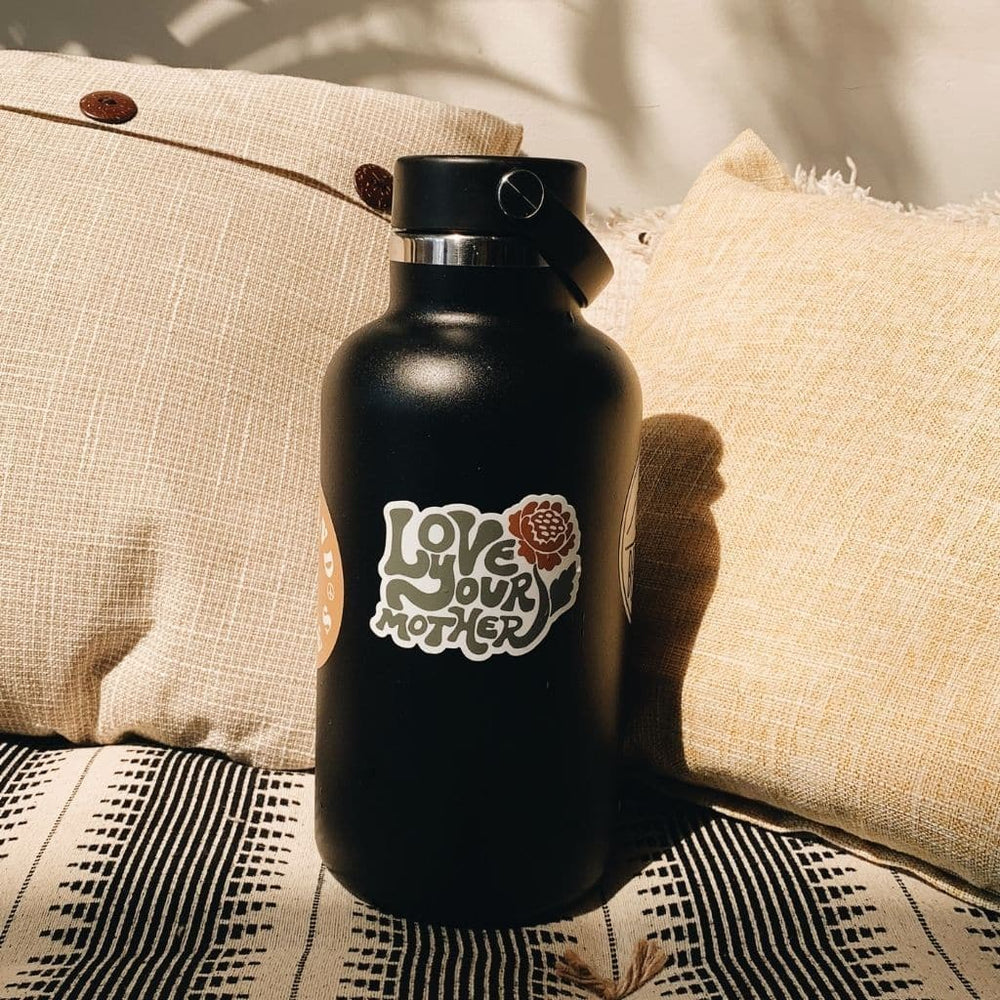 
                  
                    Hero image featuring the Be Kind Vibes Love Your Mother sticker on a black Hydro Flask
                  
                