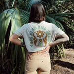 Hero image featuring the back of the Be Kind Vibes Be Kind & Shine crop top in natural